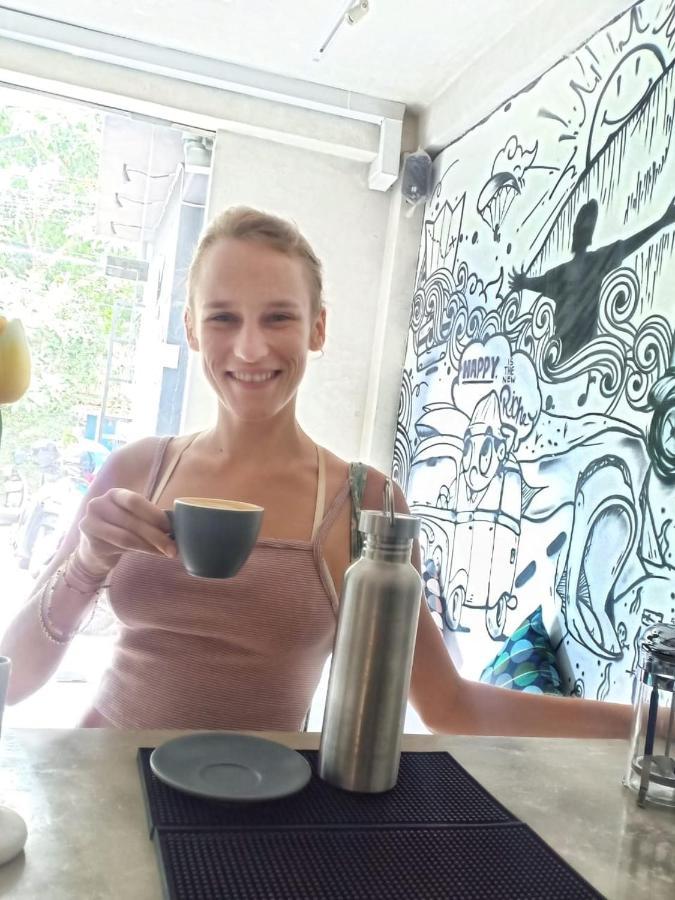 Stellar Capsules Hostel Seminyak  Exterior photo A woman drinking coffee