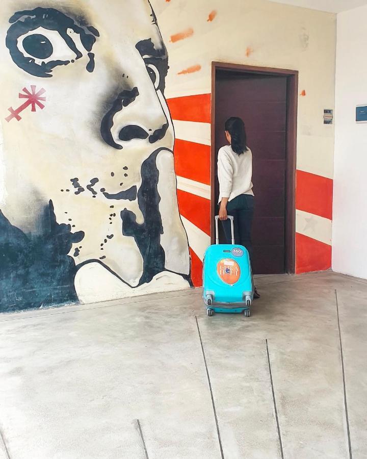 Stellar Capsules Hostel Seminyak  Exterior photo A woman with a suitcase